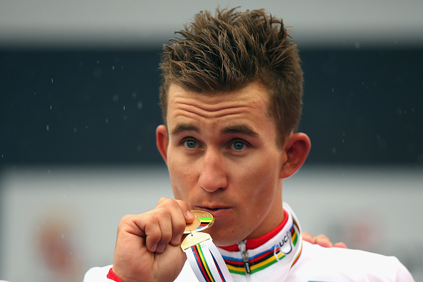Michał Kwiatkowski clutches his gold medal on the podium ©Getty Images