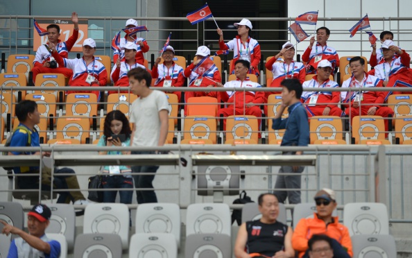 North Korean supporters celebrate their 2-0 victory over Pakistan in men's football this afternoon here at Incheon 2014 ©AFP/Getty Images