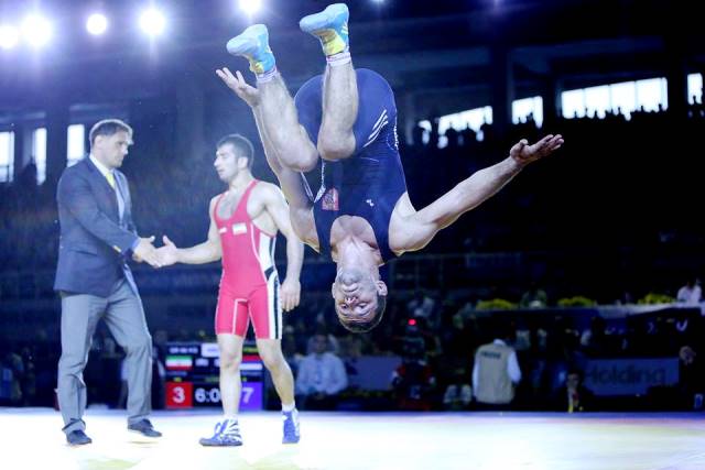 Serbian Davor Stefanek is head over heels after winning his first World Championship gold at the Gymnastics Palace in Tashkent ©Martiin Gabor/United World Wrestling