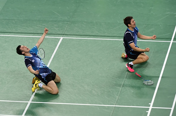 South Korea's Lee Yongdae (left) and Yoo Yeonseong celebrated winning gold in the team men's doubles badminton after beating China's Xu Chen and Zhang Nan ©AFP/Getty Images