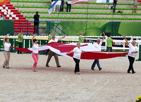 Equine Canada President, Al Patterson, President of the Bromont Organising Committee, Paul Coté, and General Manager of the Bromont Olympic Equestrian Park, Roger Deslauriers proudly parade the Canadian glad during the Closing Ceremony of the World Equestrian Games ©Cealy Tetley/FEI