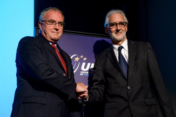 Brian Cookson (right) shakes hands with the man he succeeded as President of the UCI last September, Pat McQuaid ©AFP/Getty Images