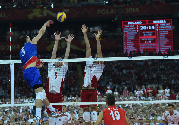 Polish players rise to block a Serbian spike in the opening match of the World Championships. In future years, the net between the players could become something of a player itself ©Getty Images