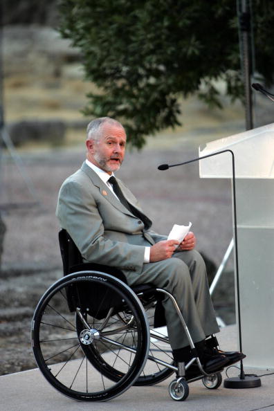 Sir Philip Craven pictured at the flame-lighting ceremony in Athens ahead of the 2004 Paralympics ©Getty Images