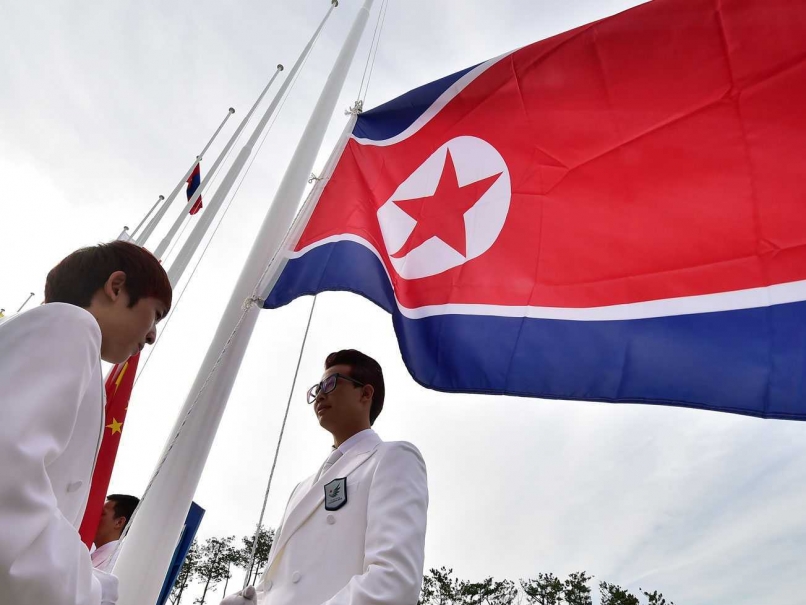 The North Korean Flag is raised in the Athletes' Village at Incheon 2014 ©AFP/Getty Images