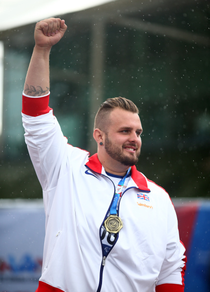 Aled Davies sent the crowd into raptures at Swansea 2014 as he threw his way to two gold medals in the shot put and discus competitions ©Getty Images