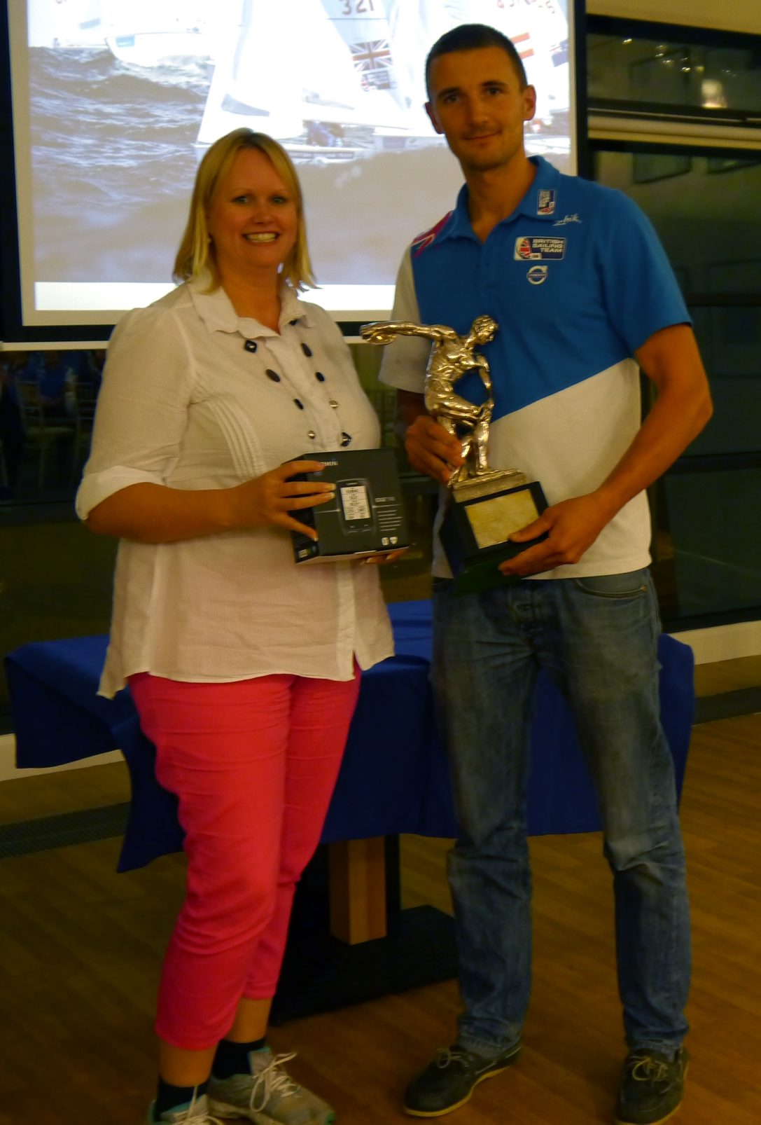 Giles Scott receiving his British Sailing Athlete of the Year award from Gail Cook marketing and communications manager at Garmin ©British Sailing Team