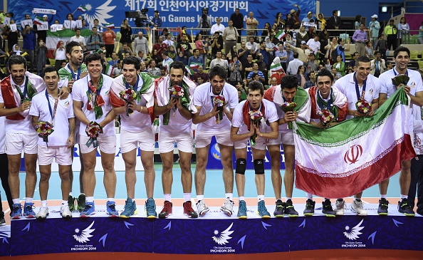 Iran celebrate on the podium after winning the Asian Games men's volleyball title. The sport is rapidly growing in popularity in the country ©AFP/Getty Images