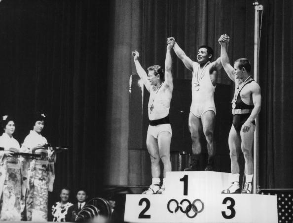 Japan's Yoshinobu Miyake won gold in front of his home crowd in the men's featherweight weightlifting ©Central Press/Hulton Archive/Getty Images