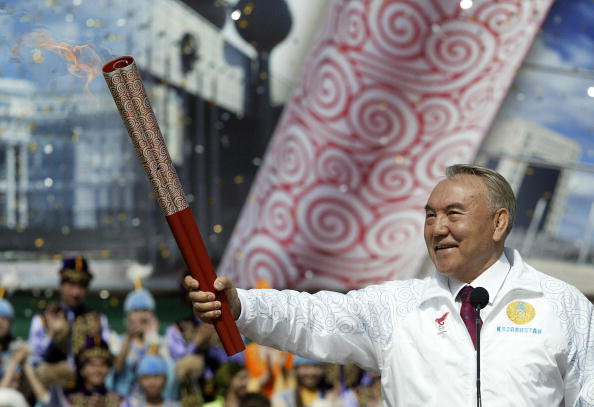 Nursultan Nazarbayev, President of Kazakhstan, holds the Olympic Torch in Almaty ahead of the 2008 Olympic and Paralympic Games in Beijing, fellow bidders for the 2022 Winter Games ©Getty Images