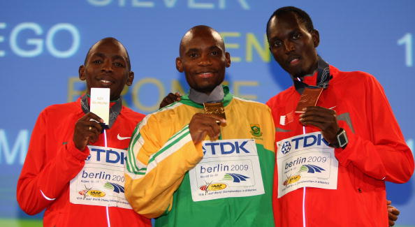 Mbulaeni Mulaudzi (centre) clutches the 800m gold medal at the 2009 IAAF World Championships ©Getty Images