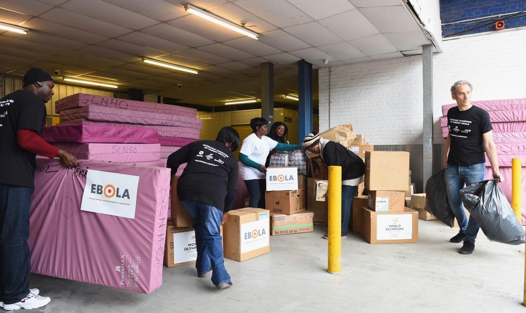 Members of London's Sierra Leone community come together to help load medical supplies into the container that will be shipped to the West African country ©WOA