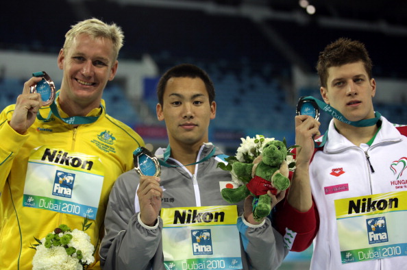 Naoya Tomita (centre) won a gold medal in the 200m breaststroke competition at the 2010 World Short Course Championships in Dubai ©Getty Images