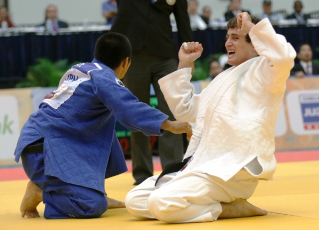 Russian Egor Mgdsyan celebrates after securing a surprise win in the final of the men's under 66kg class ©IJF