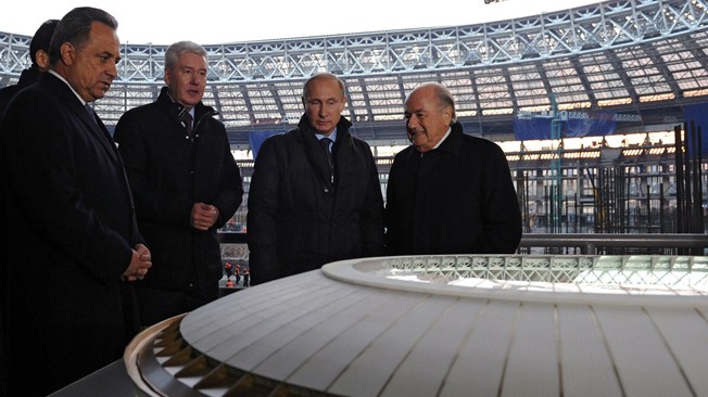 Russian President Vladimir Putin visiting the Luzhniki Stadium alongside figures including FIFA chief Sepp Blatter today ©AFP via FIFA.com