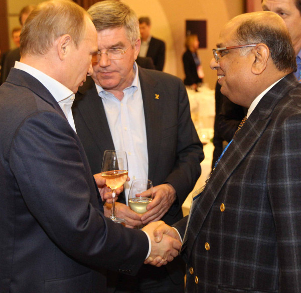 N Ramachandran informally meeting Thomas Bach and Vladimir Putin, respective leaders of the IOC and Russia, in Sochi in February shortly after his election ©WorldSquashFederation