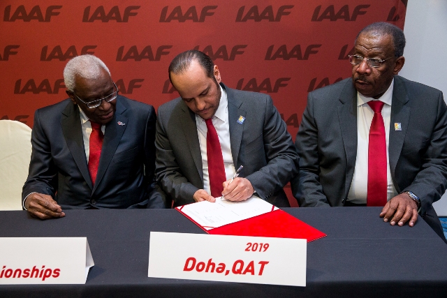 President of the IAAF, Lamine Diack, watches Sheikh Saoud Bin Abdulrahman Al-Thani, secretary general of the Qatar Olympic Committee, sign the contract to host the 2019 World Athletics Championships ©Doha 2019