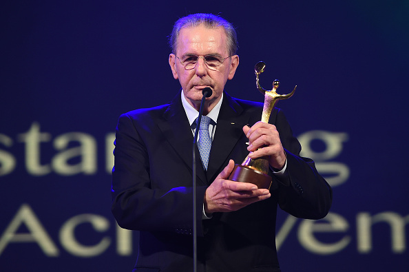 Former IOC President Jacques Rogge shows off his Lifetime Achievement award ©Getty Images