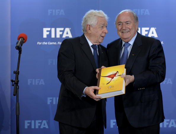 Frank Lowy, pictured with FIFA boss Sepp Blatter, has insisted Australia's World Cup bid was clean ©AFP/Getty Images