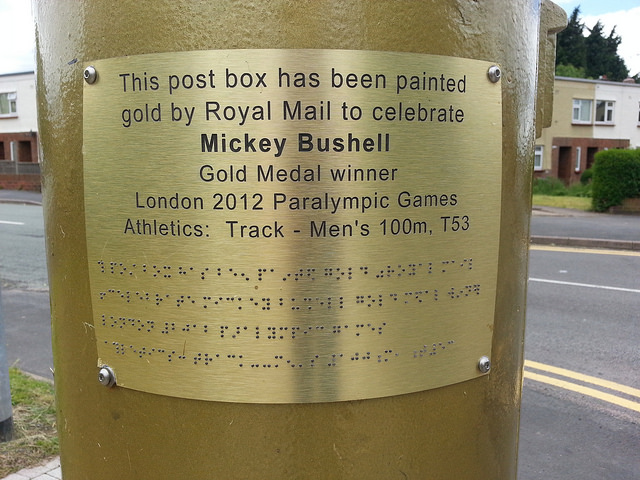 The plaque on Mickey Bushell gold post box in Telford has been removed by vandals and the police are now investigating ©Facebook