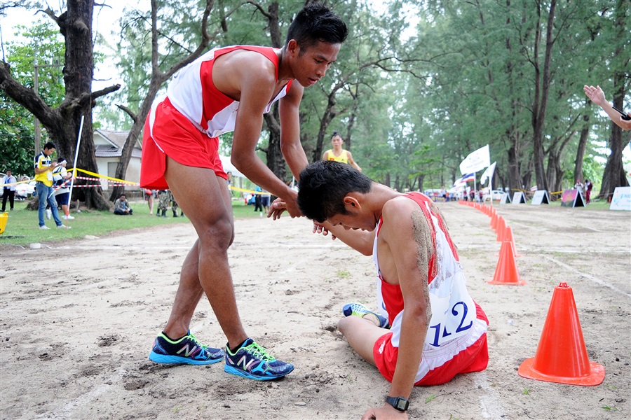 Two exhausted Indonesian runners after the gruelling eight kilometre beach cross country race ©Phuket 2014