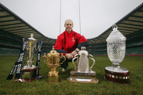Sir Clive Woodward pictured in 2004 at Twickenham with the trophies England's rugby union players have won under his guidance, including the World Cup (second left). But his impact on Southampton FC was less spectacular ©Getty Images