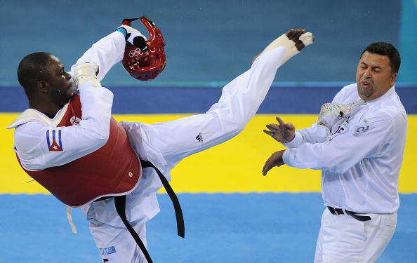Cuba's Angel Matos kicks Chakir Chelbat in the face after being disqualified from the over 80kg bronze-medal match at the Beijing 2008 Olympic Games ©Getty Images