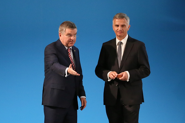 IOC President Thomas Bach presents an Olympic Medal to Swiss President Didier Burkhalter ©Getty Images