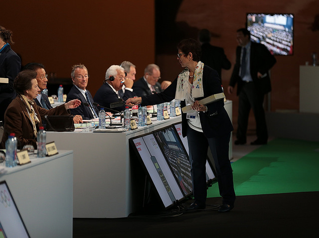 IOC members are handed their electronic voting slips ©IOC