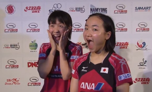 Japanese duo Miu Hirano (left) and Mima Ito (right) react to being told that they have won $40000 (£25,500/€32,100) ©ITTF