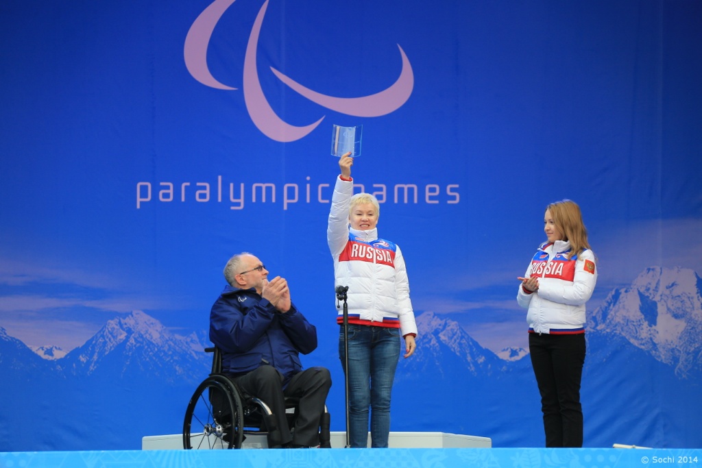 Russia's 13-time Paralympic gold medallist Rima Batalova receiving the International Women's Day Award from Sir Philip Craven in March during Sochi 2014 ©Getty Images