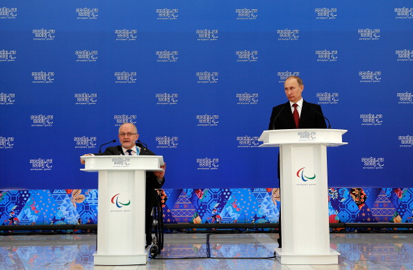 Sir Philip Craven speaking alongside Vladimir Putin during the Sochi 2014 Paralympics earlier this year ©Getty Images