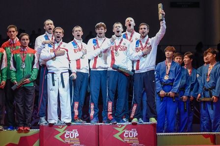 The Russian men's team sing their national anthem on the winner's podium ©WTF