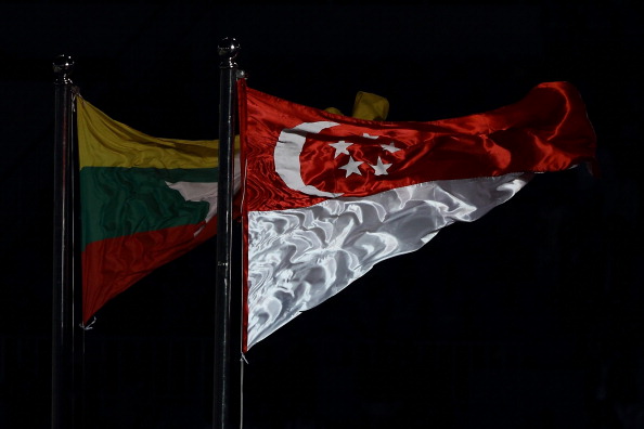The Singapore flag is hoisted during the Closing Ceremony of the 2013 Southeast Asian Games in Naypyidaw, Myanmar ©Getty Images