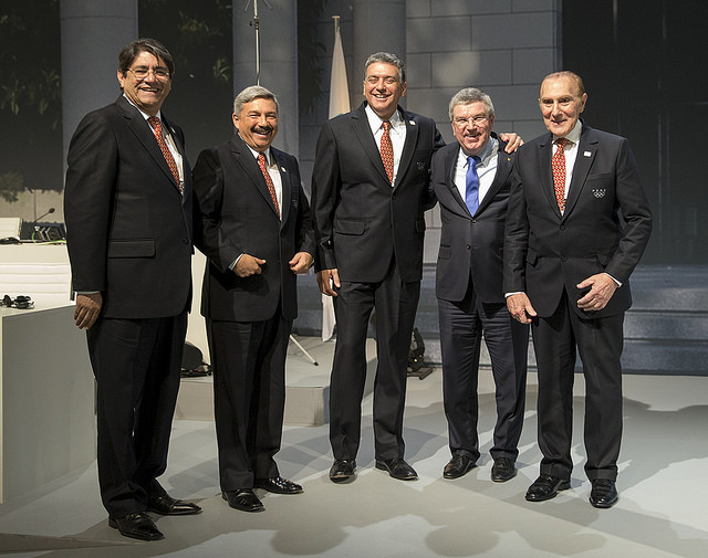 Thomas Bach congratulates Peruvian officials after Lima is awarded the 2017 IOC Session ©IOC