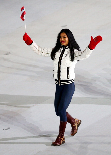 Vanessa Mae waves to the crowd during the Opening Ceremony of Sochi 2014 ©Getty Images
