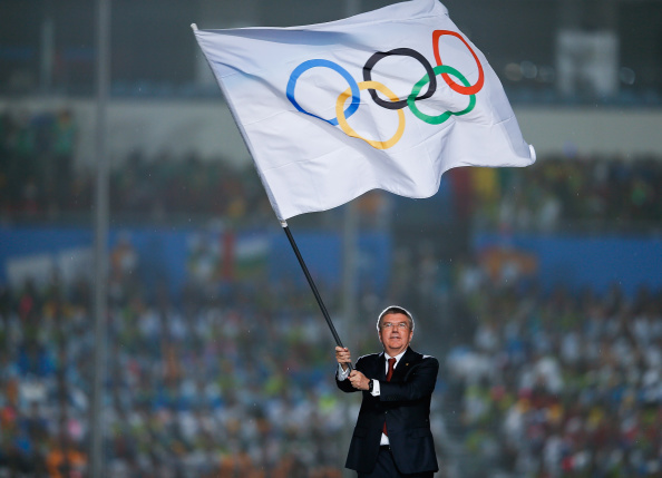 IOC President Thomas Bach waves the Olympic flag at the Closing Ceremony of the 2014 Nanjing Youth Olympic Games. At the recent Agenda 2020 Session in Monaco the President grasped a more demanding item, namely the flexible future of the Games ©Getty Images