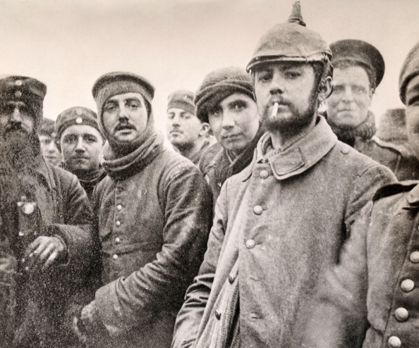 Members of the 5th London Rifle Brigade and German Saxon regimental troops gather during one of several informal truces during Christmas 1914 - this one took place near Ploegsteert Wood in Belgium ©Popperfoto/Getty Images
