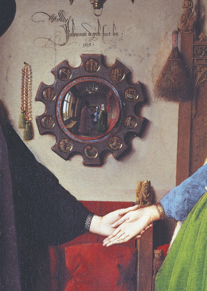 A detail from Jan Van Eyck's Arnolfini portrait of 1434 - one of the two figures in the mirror - the one in red - is reckoned to be the artist himself. An early selfie then. ©DeAgostini/Getty Images