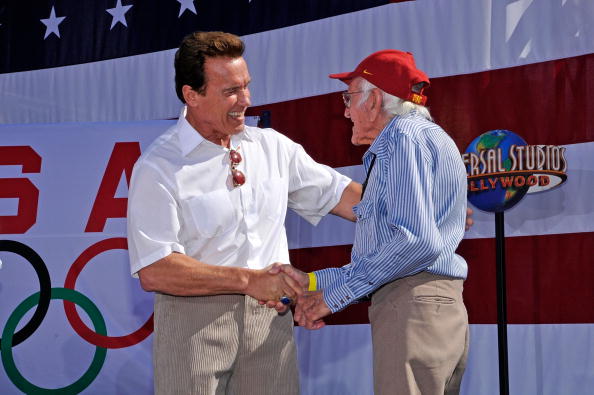 Louis Zamperini is greeted by California Governor Arnold Schwarzenegger at a 2008 ceremony honouring California Olympians and Paralympians, held at Universal Studios ©Getty Images