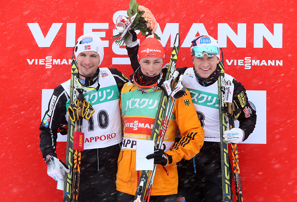Eric Frenzel (centre) celebrates his success with second-placed Jan Schmid (left) and third-placed Haavard Klemetsen (right) ©Getty Images