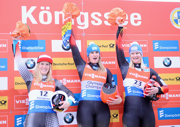 Germany's Natalie Geisenberger (centre) celebrates her victory on the podium ©Getty Images
