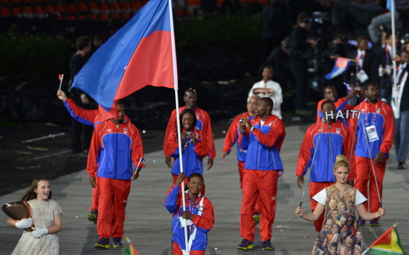 Linouse Desravine carries the Haitian flag during the opening ceremony of the London 2012 Olympic Games ©Getty Images