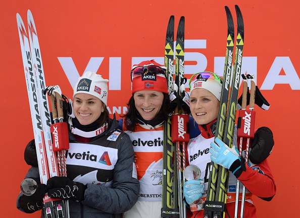 Marit Bjøergen (centre) celebrates extending her lead at the Tour de Ski by winning the second leg in Oberstdorf ©Getty Images