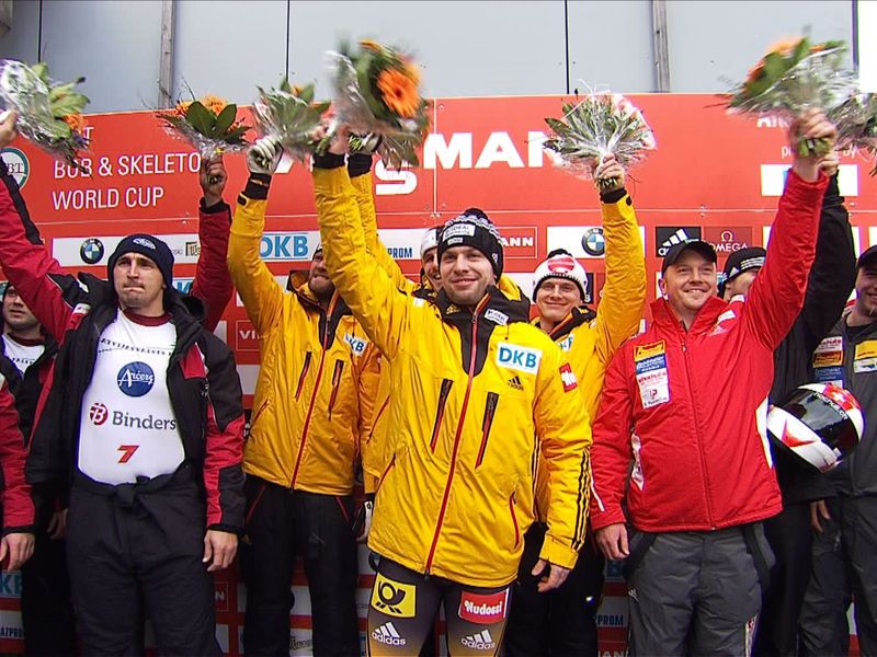 Nico Walther (centre) celebrates his first-ever World Cup victory ©FIBT