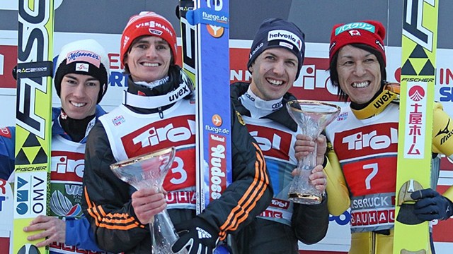 Richard Freitag (second left) celebrates with his fellow podium finishers ©FIS