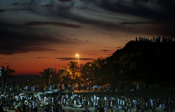 Revellers gather and await the first sunrise of 2015 during New Years festivities at Arpoador in Rio de Janeiro, a year Brazilian organisers are promising will be full of "milestones" for next year's Olympics and Paralympics ©Getty Images 