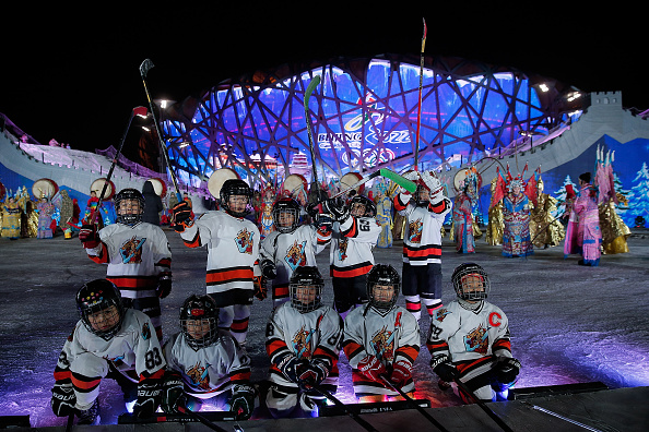 Young ice hockey players perform during a New Year's eve countdown event to promote the city's 2022 Winter Olympic and Paralympic bid outside the Bird's Nest ©Getty Images