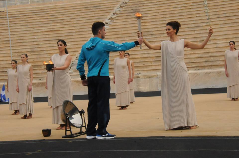 The Olympic flame is handed over to a representative of the jointly hosted Winter European Youth Olympic Festival in Athens in January ©EYOF2015
