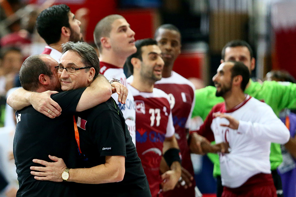 Qatar's coach Valero Rivera gets a hug as his side take in becoming the first non-European team to reach the World Handball Championships ©Getty Images